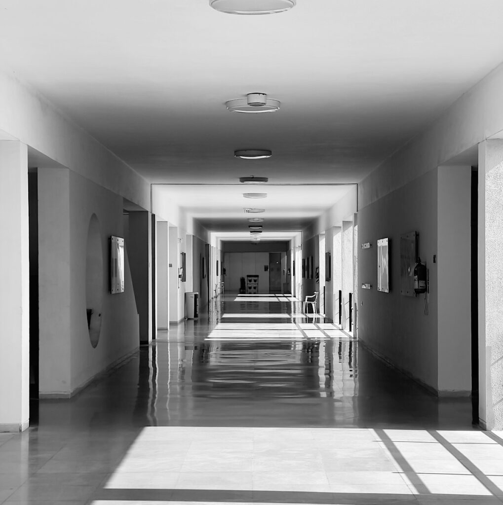 a long hallway with a clock on the wall
